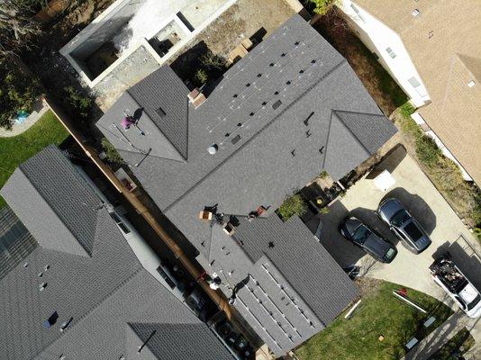 top view new Owens Corning 20+ SRI roof and solar hardware