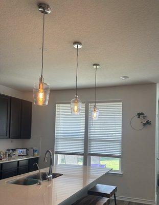 Installed new pendant lights for our customer. They had no pre existing pendant lights over the island and now customer is happy as can be!