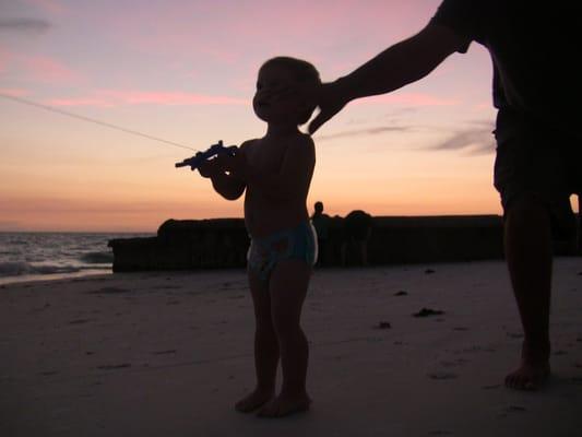 my son learning to fly a kite on siesta beach.