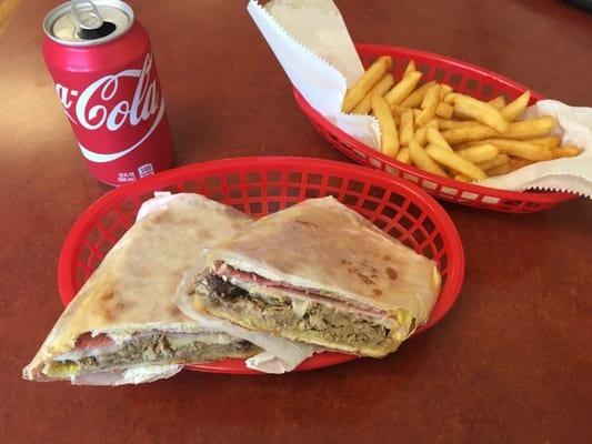 Cuban sandwich. Pickles don't come on the sandwich, but would've helped a lot. Fries cost extra.