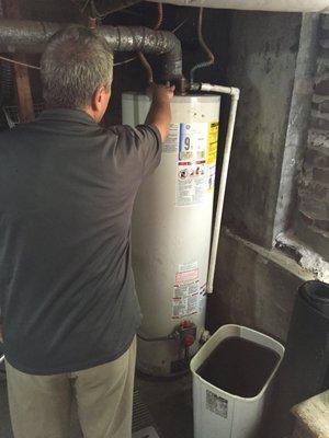 Inspecting a boiler to ensure proper operation and hot water supply