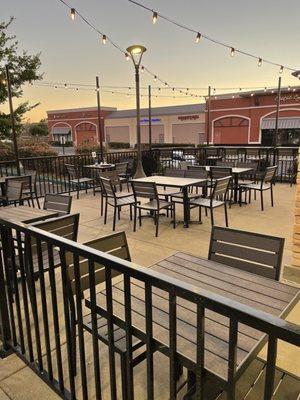 Outdoor patio. It's layed out nicely. No awning or umbrella could get hot.