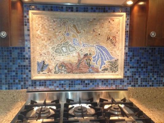 mosaic tile mural with surround and glass tile backsplash