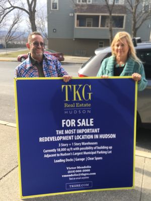 TKG's Principal Broker Lisa Bouchard Hoe and I get ready to put some new signage on a centrally located redevelopment project in Hudson.