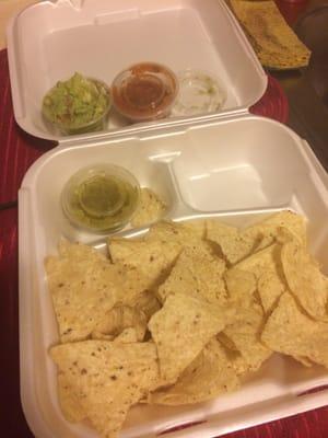 Small portion of one small guacamole special ordered (other two are salsas)