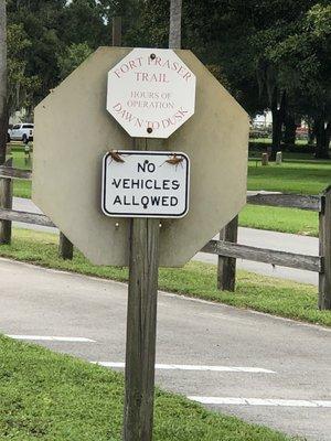 Sign for trail immediately in front of cemetery