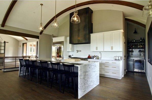 Residential kitchen/home remodel- cabinetry, island, steel stove hood and new flooring.