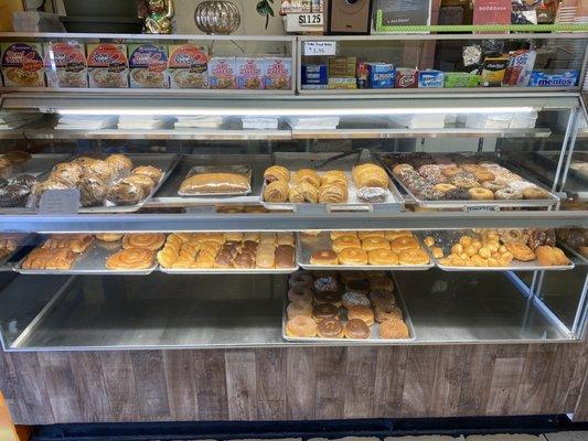 The donut and baked goods section. This is where the fly was on the top right shelf closest to the window near the dark chocolate donut.