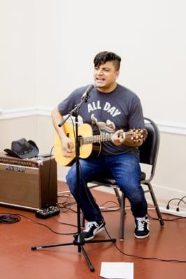 Student Oscar plays at a JVL event