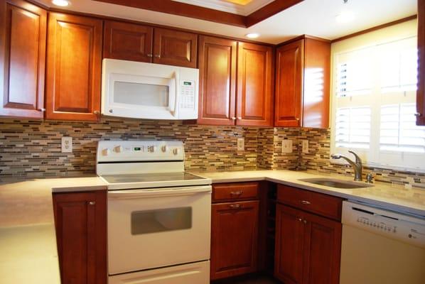 Flooring By Tile Experts Removed The Old Backsplash And Dry Wall, & Installed A 12''x12'' Stone & Glass Mosaic Sheets