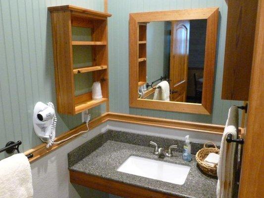 Mirror frames and bathroom shelves made from reclaimed longleaf pine