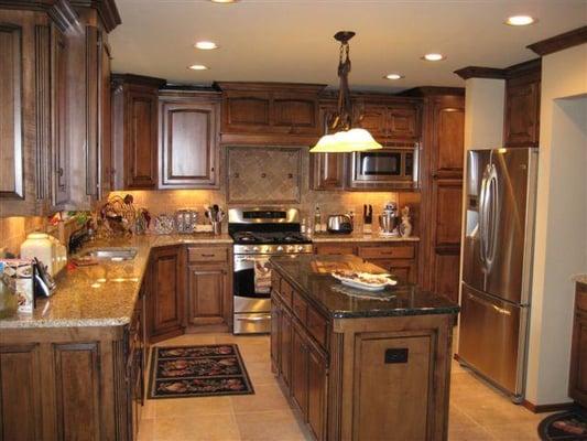 Alder cabinets, all new appliances with new granite counter tops, tile back splash and tile floor.