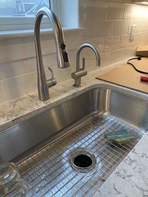 Instant hot installed next to kitchen faucet