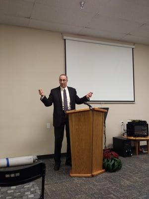 Pastor Cox preaching at our church.