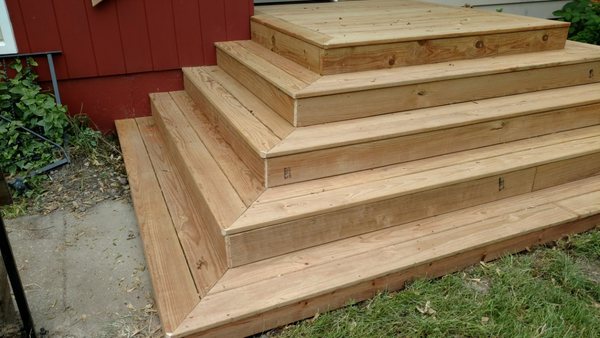 This was originally an old concrete slab set of steps. Concrete was removed and replaced with an attractive set of wood steps.