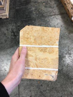 What we call "envelope sized" bundles of A grade maple burl veneer.