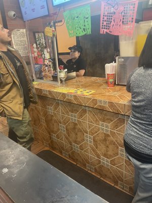 Miserable cashier, who clearly has no customer service skills. And making a burrito is a hard job.