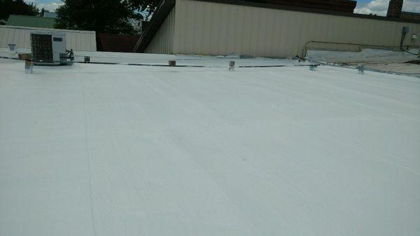 Ballasted membrane removed. Insulation, fabric, and coatings applied. 12 yr nonprorated warranty. yutzycommercialroofing.com