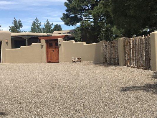 Entry wall, gates, pillars and coyote fencing