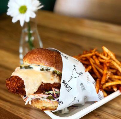 Crispy Chicken Sandwich: Panko Fried Chicken, Muenster & Provolone Cheese Sauce, B&B Pickles, Cole Slaw, Crispy Shallot Aioli. By Marie Yoon