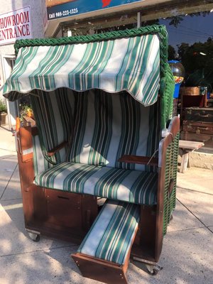 This is called a Strandkorb.  It's a German beach basket!  aka...a great lounger by the pool!