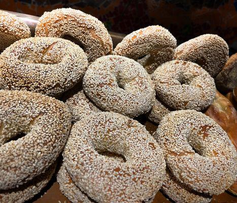 Sesame Bagels stacked right by the oven