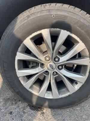 Right front tire with two lug stems and one lug nut missing after Firestone Service.