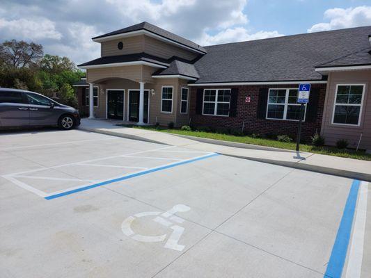 Front of the building with handicap parking space