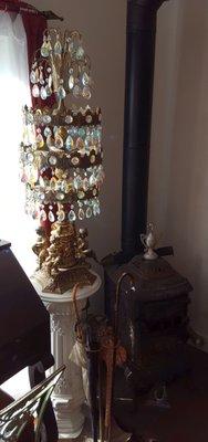 Antique lamp and wood-burning fireplace in one corner of the dining room.