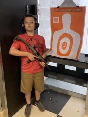 My sons first time, great grouping with the fully automatic Uzi 9mm.