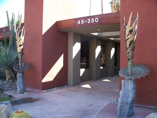 At the entrance to Desert Art Collection & Sculpture Garden are two of Max DeMoss' bronze and granite whirlwinds with platter.