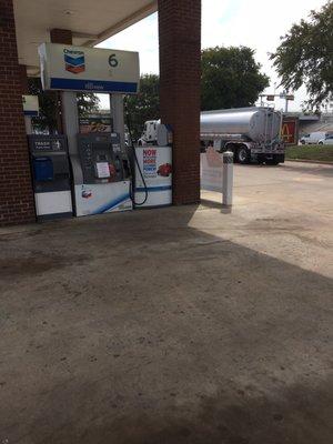 New gas tanker just pulling in to restock this gas station.