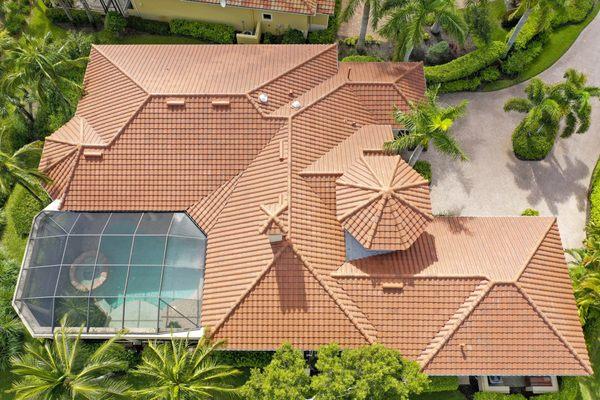 Red tile reroof in Naples, FL by Crowther Roofing.