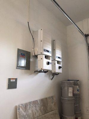 Took the whole wall of drywall down in order to hide all conduit. . Junction box, combiner panel, and two Solar Edge inverters..... CLEAN