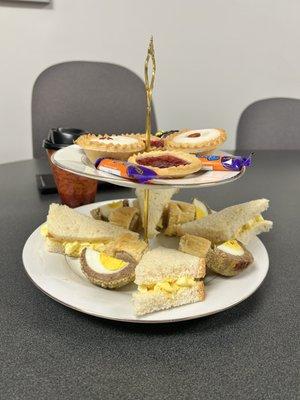 High Tea (tea, Bakewell Tarts, Jamwell Tarts, Eclairs, Fudge, egg salad sandwiches, sausage rolls, and scotch eggs).