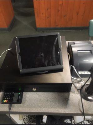 iPad with cash drawer, printer, and credit card reader installed as apart of a point of sale system installed in a local restaurant