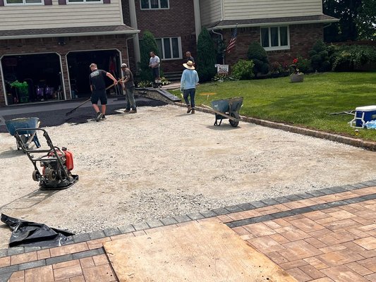 blacktop driveway with belgium block edge and Cambridge armortec paver apron and stoops with veneer stone facing