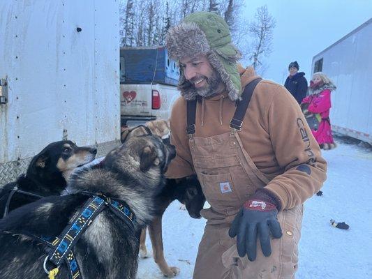 Brett getting the dogs ready for the Willow 300 race in Alaska while veteran Iditarod mushers Andy Pohl and Deedee Jonrowe look on.