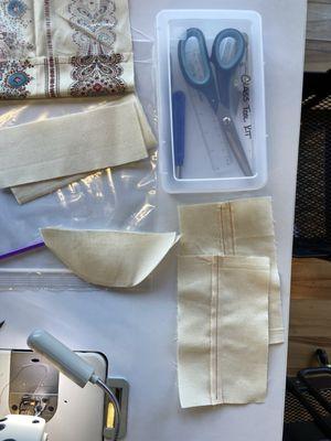 Sewing tools kit and practice pieces