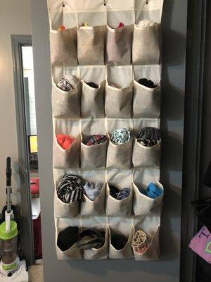 Don't know what to do with that flimsy shoe organizer? We found a great use for it, store your scarves in it.