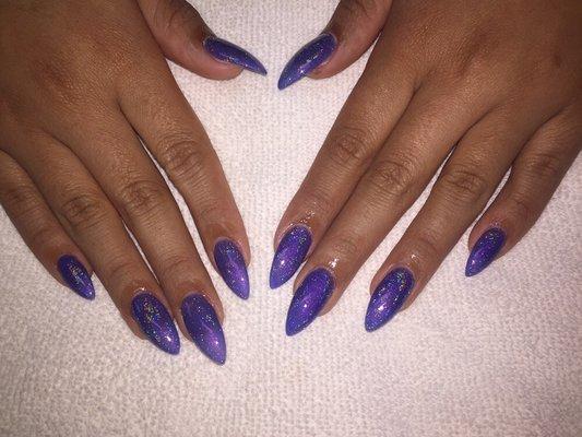 Rainbow halo chrome on purple gel color on oval stiletto hard gel nails with flash