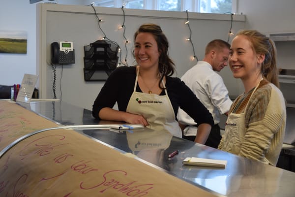 Jamie (Managing Partner) and Cara (Chief Barista), with Chef Mike in the background.