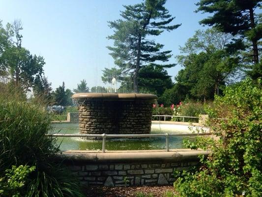 Wishing fountain with benches and native flowers surrounding