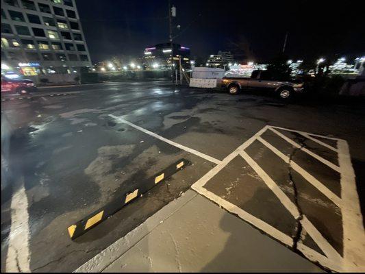 Other side of handicap ramp, spaces but no handicap. HORRIBLE LOCATION. SHOP ELSEWHERE