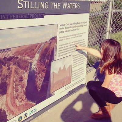 My daughter educating me regarding the auxiliary dam project, which was under construction at the time, 2016