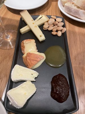 Happy hour cheese board, mongers choice. Very disappointing accoutrements for the cheese selection. 2 of 3 cheese were very good