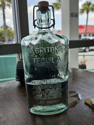 Water served in a tequila bottle.