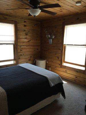 Cabin 1 master bedroom offers a queen sized bed.