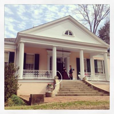 One of the great-great granddaughters of the builder greeting guests on the front gallery.