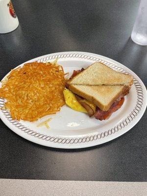 Bacon egg and cheese sandwich with basic 'browns